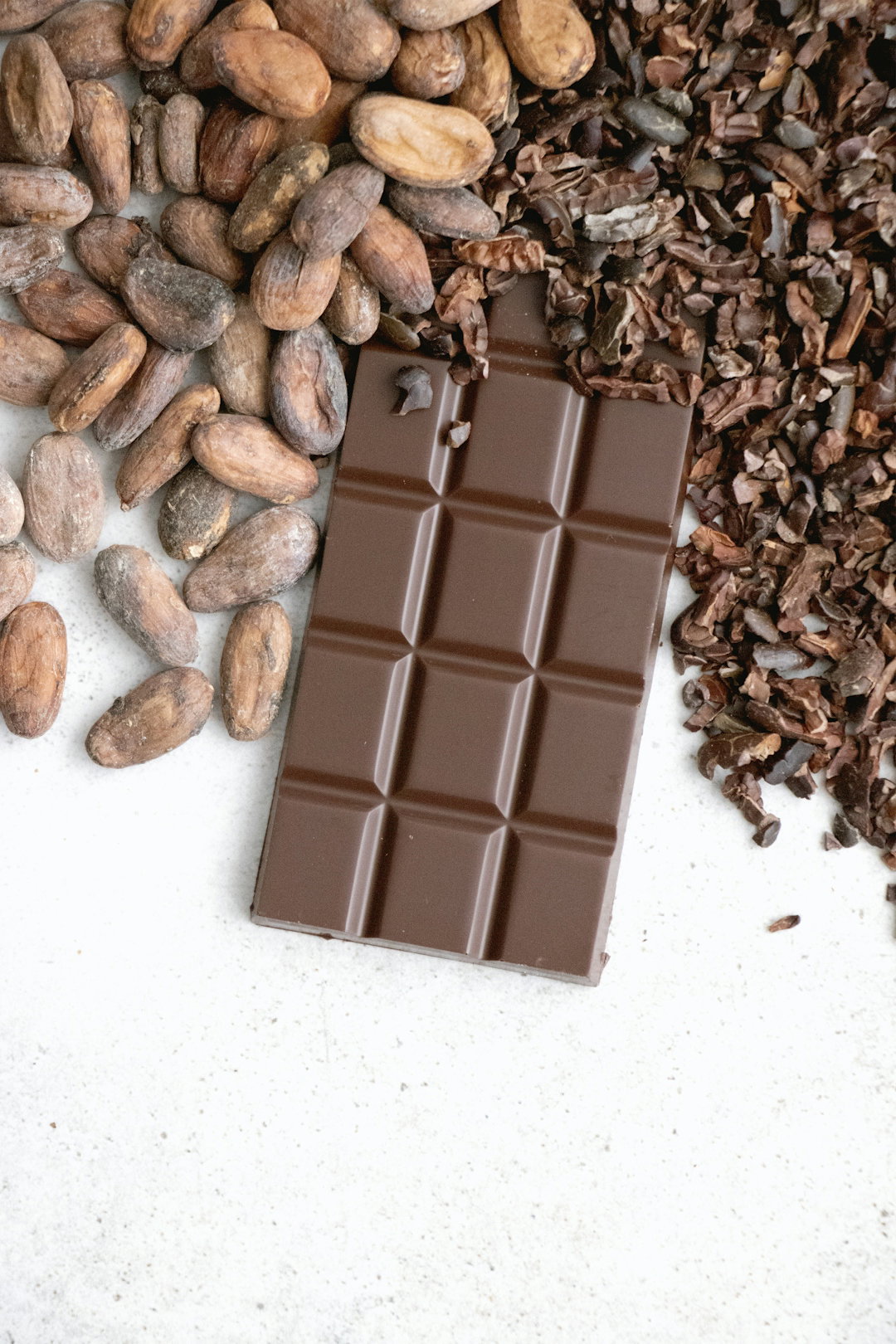 a-bar-of-chocolate-next-to-a-pile-of-nuts.jpg a bar of chocolate next to a pile of nuts
